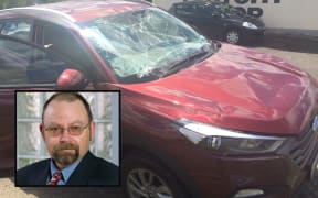 Colin Pitt and his Hyundai SUV after the bonnet flew up as he drove.