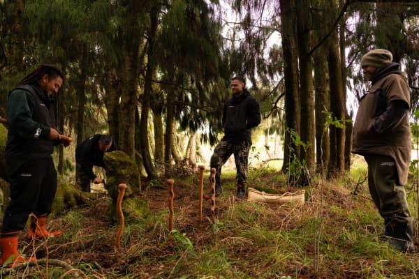 Left to right: Parekaia Tapiata, Te Aorere Pewhairangi, and Che Wilson stand outside smiling at each other