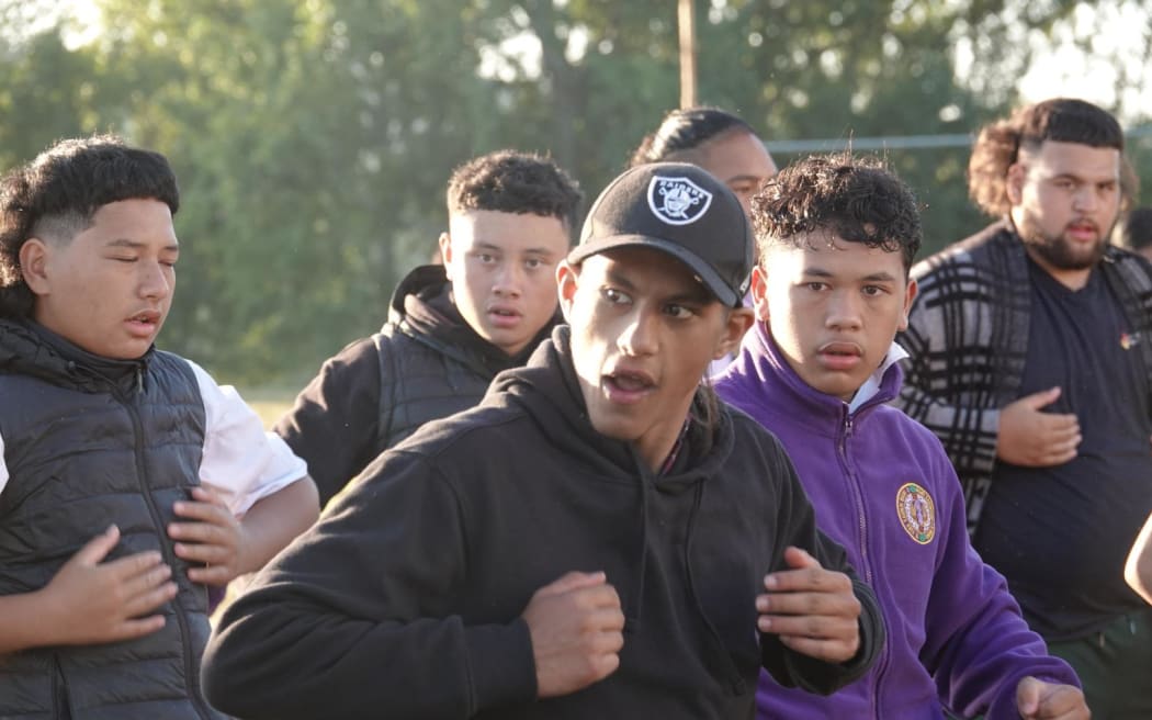 Young people doing a haka.