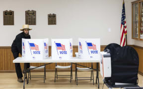 An Amish man votes at a polling station at the Witmer Fire Department in Witmer, Pennsylvania, on Election Day, November 5, 2024. (Photo by Ryan Collerd / AFP)