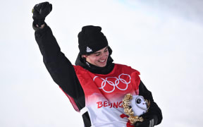 New Zealand's Nico Porteous on the podium after winning the freestyle skiing men's freeski halfpipe final.