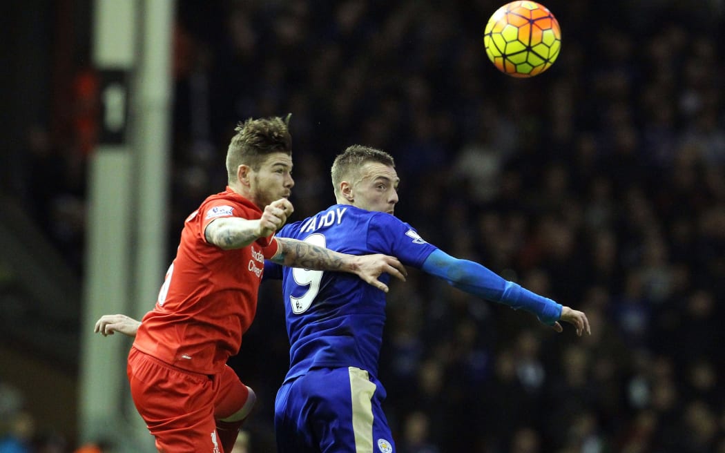 Liverpool's Spanish defender Alberto Moreno (L) vies with Leicester's English striker Jamie Vardy