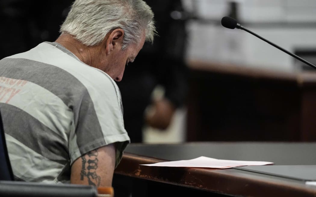 WINDER, GEORGIA - SEPTEMBER 6: Colin Gray, 54, the father of Apalachee High School shooting suspect Colt Gray, 14, enters the Barrow County courthouse for his first appearance, on September 6, 2024, in Winder, Georgia. Colin Gray is being charged with involuntary manslaughter, second-degree murder and cruelty to children after his son opened fire and killed 4 at the high school on Wednesday.   Brynn Anderson-Pool/Getty Images/AFP (Photo by POOL / GETTY IMAGES NORTH AMERICA / Getty Images via AFP)