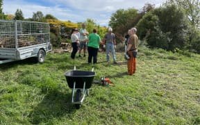 Volunteers working on the cleanup and clearing of the site of the Garden of Harmony extension in Methven ahead of planting in April.