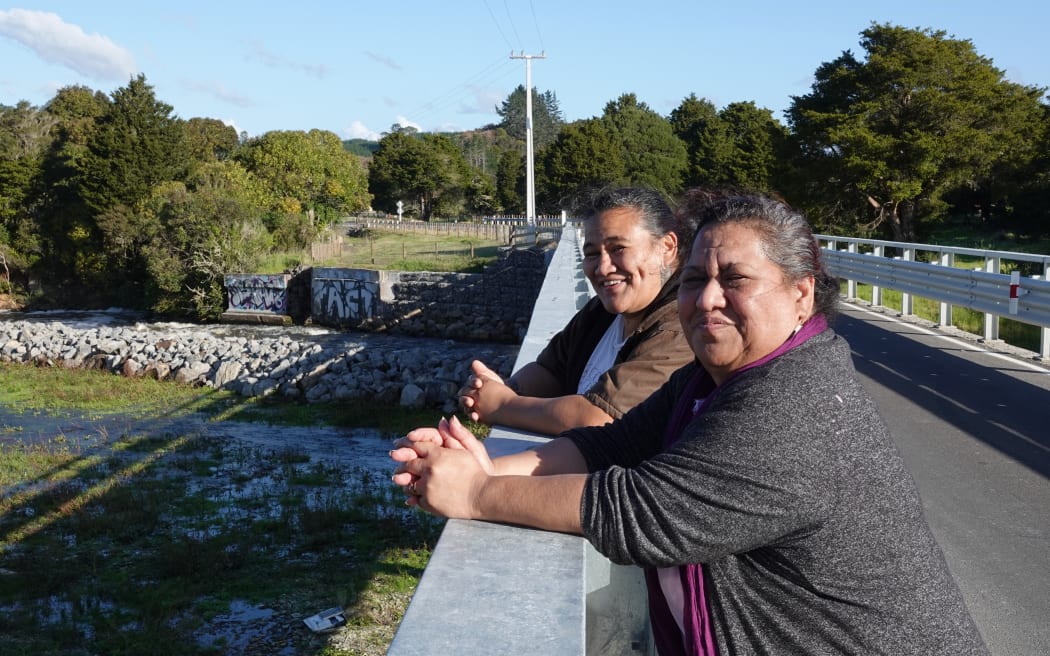 Community advocate Pamela-Anne Ngohe-Simon, left, and landowner Josephine Kemp-Baker at the new Pokapu Bridge over the Waiharakeke River.
