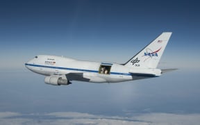SOFIA in flight with the telescope door open.