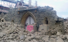 Collapsed church corner of Durham and Chester.  Three people removing the church organ were killed in here when the earthquake struck.