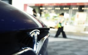 A Tesla Model S car is for sale at a dealership in Hangzhou city, east China's Zhejiang province, 19 June 2018.