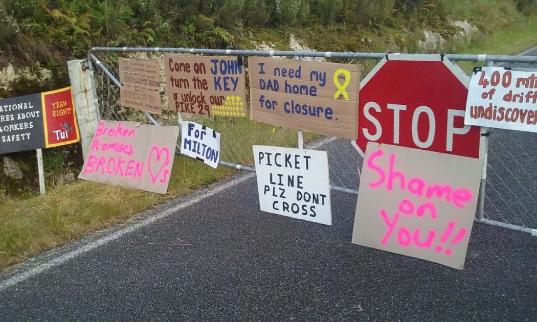 Families of the Pike River dead protest at the sealing of the mine.