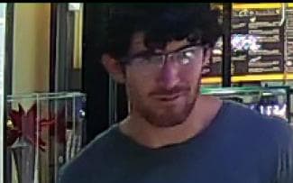 Police photo of the man accused of stealing a $36,000 ring.