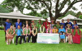 Members of Tauturu Aotearoa with the cheque for New Zealand.