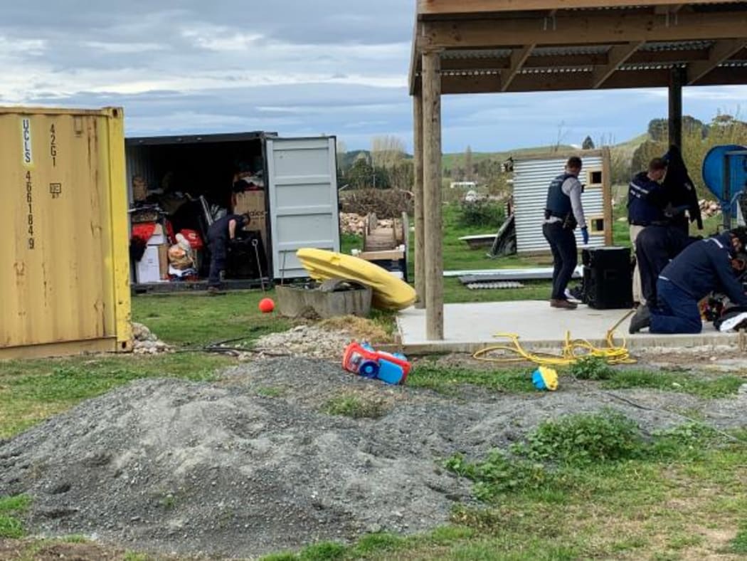 Police staff search a property in Wairoa today.