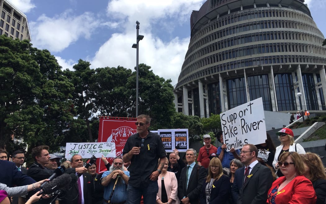 Families of the Pike river mine disaster victims and their supporters gathered outside parliament to release a new plan for entering the mine.