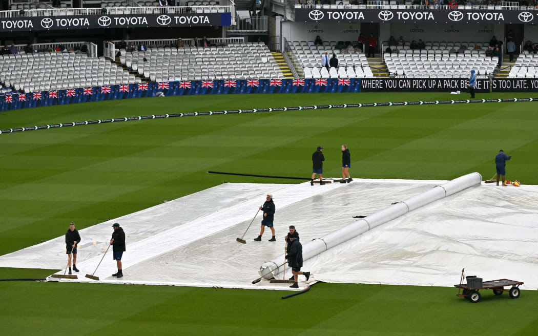 The rain covers are pictured on the square before day three of the first cricket test match between England and New Zealand at Lord’s cricket ground in London on June 6, 2026. (Photo by Glyn KIRK / AFP) / RESTRICTED TO EDITORIAL USE. NO ASSOCIATION WITH DIRECT COMPETITOR OF SPONSOR, PARTNER, OR SUPPLIER OF THE ECB