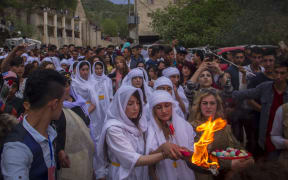 Iraqi Yezidis gather to celebrate Yezidi New Year, known as Chwarshaba Sor or Red Wednesday, in Dohuk on 18 April this year.