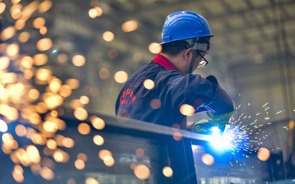 QINGZHOU, CHINA - AUGUST 27, 2023 - A worker welds at a temperature control equipment manufacturing enterprise in Qingzhou Economic Development Zone, East China's Shandong province, Aug. 27, 2023. On the same day, the National Bureau of Statistics released data, from January to July, the total profit of industrial enterprises above designated size in the country was 3,943.98 billion yuan, down 15.5% year-on-year, and the decline was 1.3 percentage points narrower than that in January to June. (Photo by Costfoto/NurPhoto) (Photo by CFOTO / NurPhoto / NurPhoto via AFP)