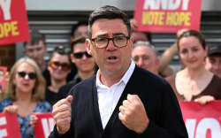 Labour party candidate Andy Burnham addresses supporters outside the Labour party campaign office in Ashton in Makerfield, northwest England, on June 18, 2026, as voters go to the polls to vote in the Makerfield by-election. Britain holds a unique vote on June 18 that could trigger the endgame for Labour leader Keir Starmer’s beleaguered premiership, or win him a reprieve. (Photo by Oli SCARFF / AFP)