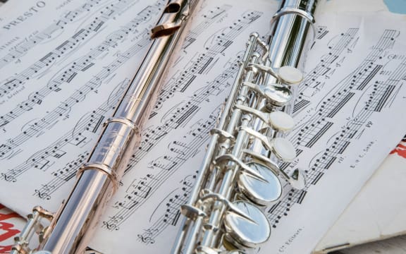 Flutes on music manuscript.
