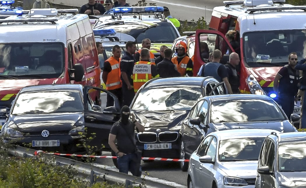 Emergency services surround the BMW after a high-speed motorway chase