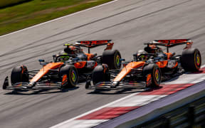 McLaren drivers Lando Norris (L) and Oscar Piastri