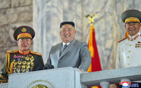 This picture taken on October 10, 2020 shows North Korean leader Kim Jong Un (C) attending the military parade during a ceremony to mark the 75th anniversary of the Workers' Party of Korea at Kim Il-sung Square of Pyongyang.