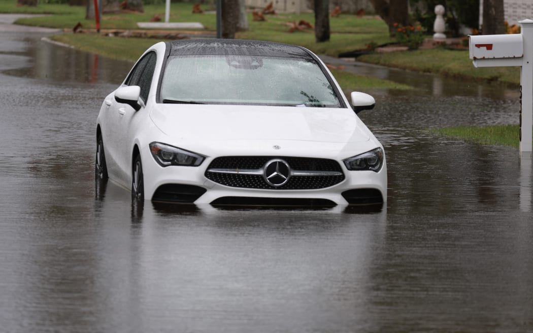 A car stranded in floodwaters in St. Petersburg, Florida, as Hurricane Helene reaches the level of a Category 3 storm, offshore, on 26 September, 2024.