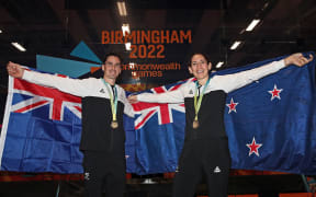 Joelle King and Paul Coll of New Zealand celebrate their mixed doubles Gold Medal win during Birmingham 2022 Commonwealth Games.