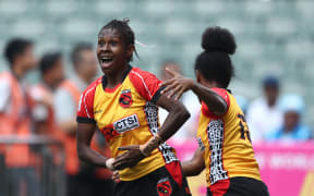 Papua New Guinea's Alice Alois celebrates a try against Scotland during the Women's World Sevens Series Qualifier in Hong Kong.