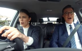 A screengrab of Prime Minister Jacinda Ardern and Stephen Colbert singing Queen's Bohemian Rhapsody.