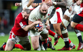 England's Joe Marler tackled by Wales' Ken Owens