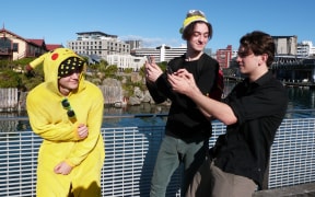Campbell Beecroft, Charlie Jones and James Tweddell join about 1000 people to play Pokemon Go in Wellington.