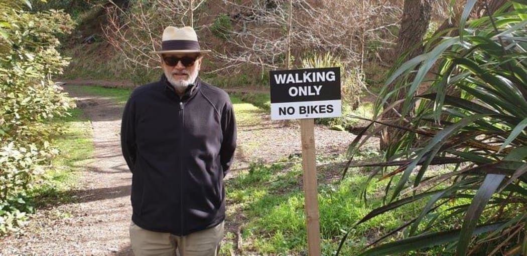 Garry Rigby next to a walking only sign at Tainui Reserve in Havelock North.
