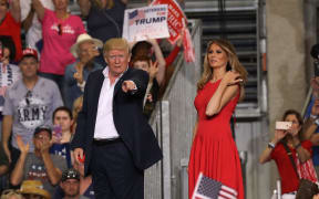 Donald Trump and Melania Trump during a campaign rally at Orlando Melbourne International Airport.