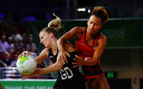 Katrina Grant of New Zealand competes against Serena Guthrie of England. Gold Coast 2018 Commonwealth Games, Netball, New Zealand Silver Ferns v England, Gold Coast Convention and Exhibition Centre, Gold Coast, Australia. 11 April 2018 © Copyright Photo: Anthony Au-Yeung / www.photosport.nz