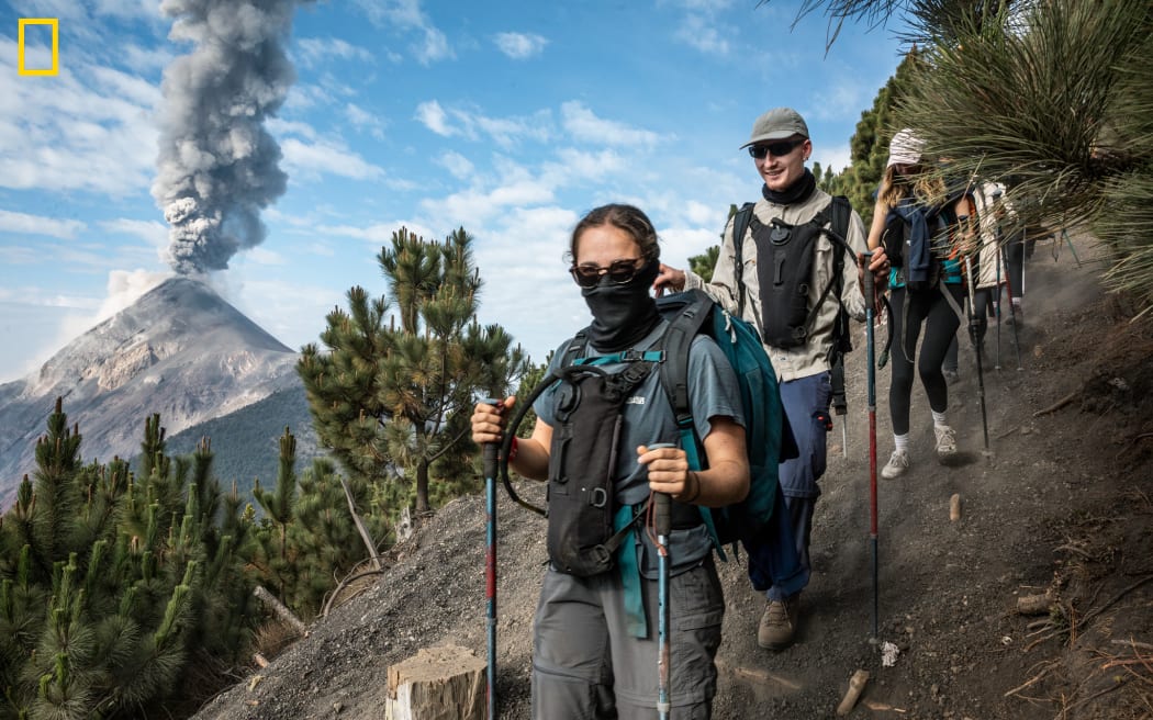 Antigua, Guatemala
MM10206_240405_01092
One of the world’s most active volcanoes, Volcán de Fuego erupts in the background while hikers tackle Acatenango in Antigua, Guatemala. (Photo by Peter Fisher for National Geographic)