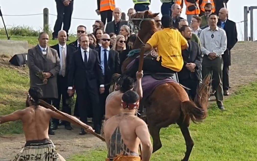 Andrew Little receives a wero (challenge) delivered from horseback.