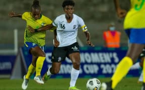 Fiji's captain Sofi Diyalowai holds off her Solomons foe in their Nations Cup tie in Suva
