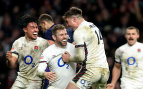 Elliot Daly of England celebrates scoring the winning try against France.