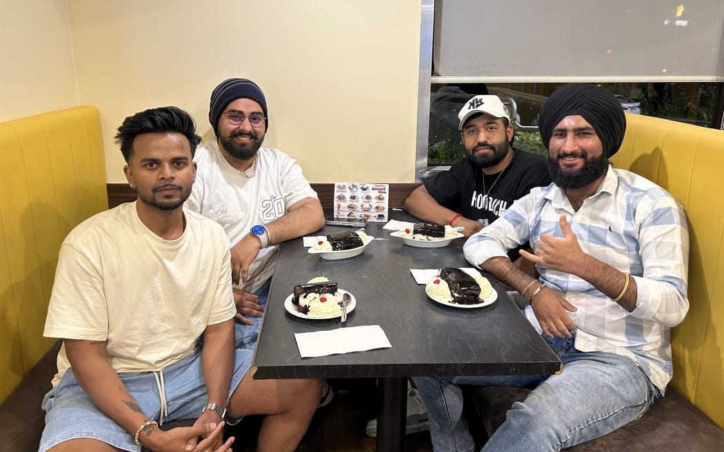 A photo of Shivam Kumar, Ashu Singh, Tanish Tomar and Amanjyot Saini having hot fudge cakes at Denny's