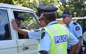 Solomon Islands traffic police learning to use the new breathalyzer kits.