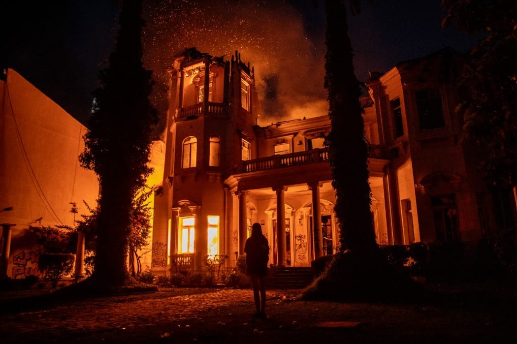 University headquarters is set on fire as demonstrations continue against Chilean President Sebastian Pinera, the 50th consecutive day of unrest in Santiago, Chile.