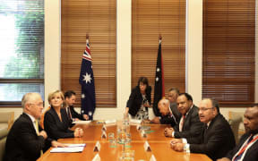 Australian Prime Minister Malcolm Turnbull and his cabinet colleagues (left side of table) meet with his PNG counterpart Peter O'Neill and members of his National Executive Council.