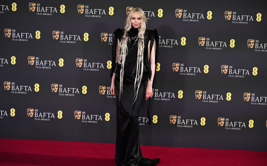 British actor Gwendoline Christie poses on the red carpet upon arrival at the BAFTA British Academy Film Awards at the Royal Festival Hall, Southbank Centre, in London, on February 16, 2025.
