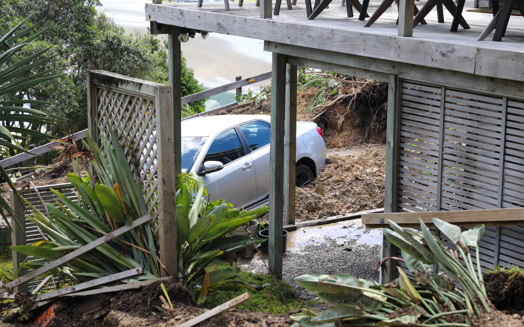 Tairua slip - Motuhoa Road on Mount Paku - a property is extensively damaged as a landslide comes down behind it - 22 January 2026