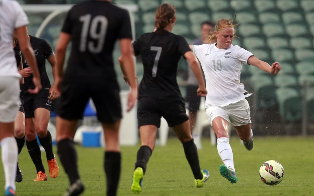 Football Ferns' CJ Bott looks to pass the ball at a match in Auckland in January 2106.