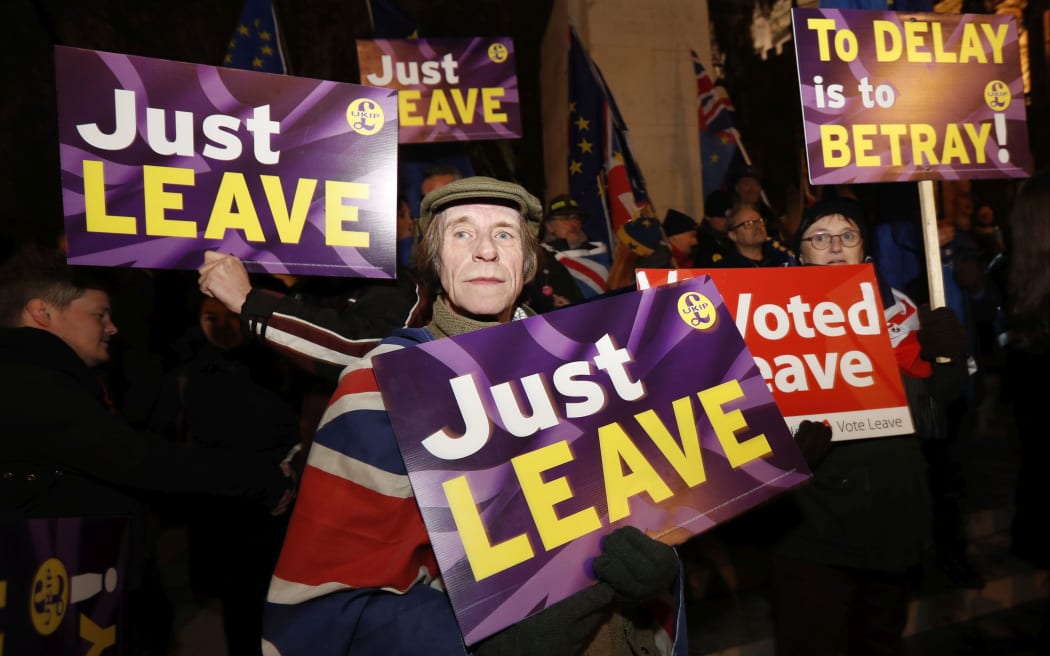 Pro-leave supporters gather near the Houses of Parliament in London, Tuesday, Jan. 29, 2019.