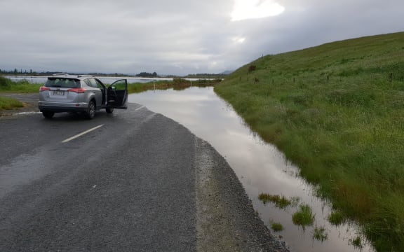 A road to Henley is cut off after heavy rain flooded Otago.