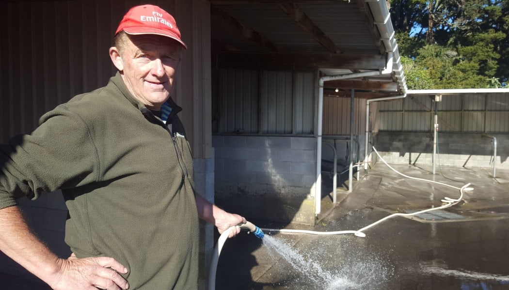 At New Plymouth's Pukekura Raceway course, attendant Geoff Herbert mucking out the stables.