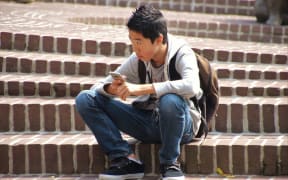 Asian boy on steps