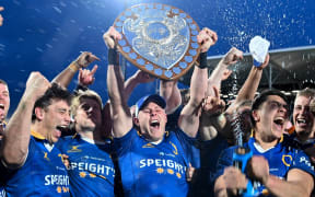 Sam Gilbert of Otago lifts the Ranfurly Shield during the NPC and Ranfurly Shield Rugby match - Canterbury V Otago at the Apollo Projects Stadium.